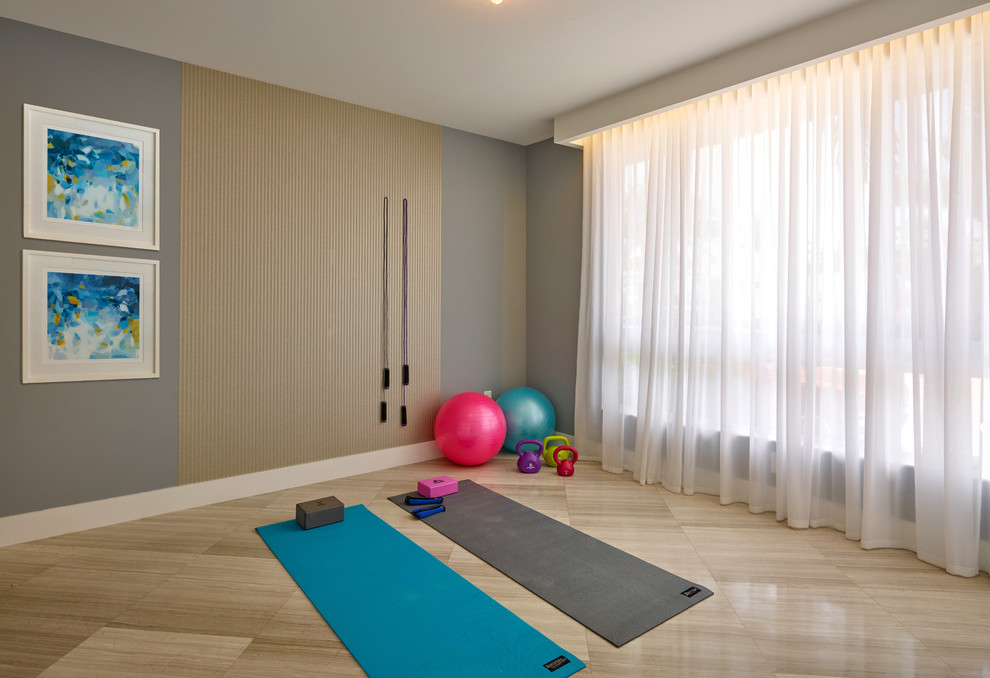 Design ideas for a mid-sized contemporary home yoga studio in Miami with grey walls.