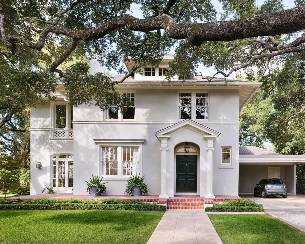 Design ideas for a large traditional two-storey white house exterior in Austin with a hip roof.