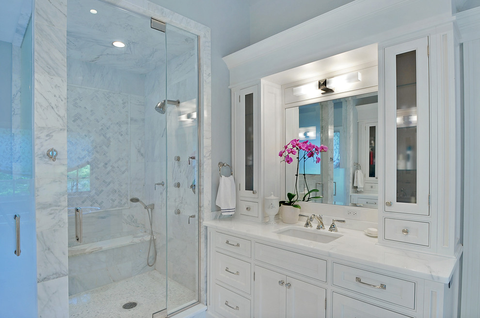This is an example of a transitional bathroom in Chicago with marble benchtops and white benchtops.