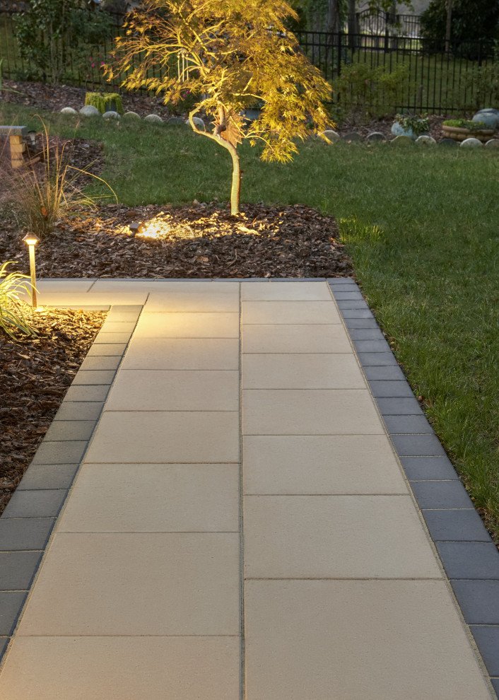 Inspiration for a contemporary backyard concrete paver landscaping in Philadelphia.