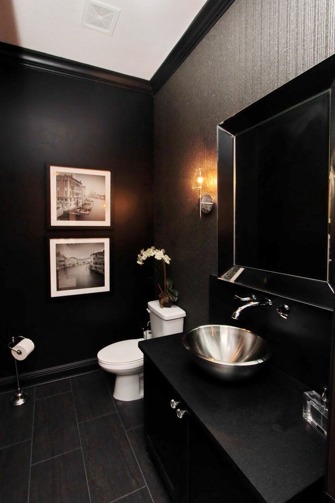 Inspiration for a mid-sized contemporary powder room in Tampa with flat-panel cabinets, black cabinets, a one-piece toilet, black walls, painted wood floors and a vessel sink.
