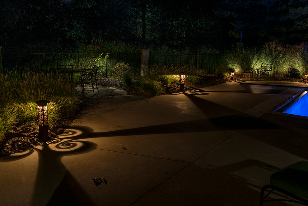Inspiration for a mid-sized backyard concrete and rectangular pool remodel