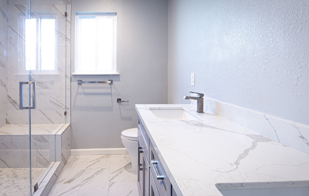 This is an example of a modern bathroom in San Francisco with grey cabinets, an open shower, multi-coloured tile, marble, marble floors, an undermount sink, marble benchtops, multi-coloured floor, a sliding shower screen, multi-coloured benchtops, a double vanity and a built-in vanity.