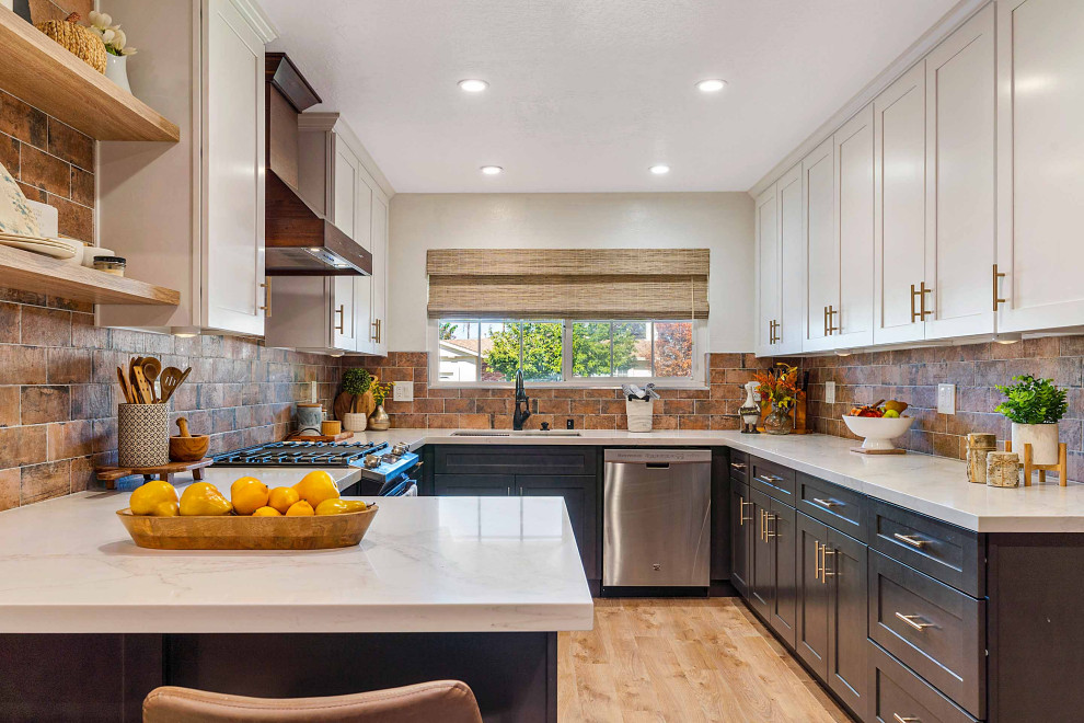 Kitchen pantry - mid-sized rustic u-shaped light wood floor and brown floor kitchen pantry idea in San Francisco with an undermount sink, shaker cabinets, white cabinets, quartz countertops, brown backsplash, porcelain backsplash, stainless steel appliances, a peninsula and white countertops