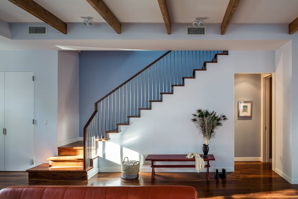 Inspiration for a contemporary wood l-shaped staircase in New York with wood risers.