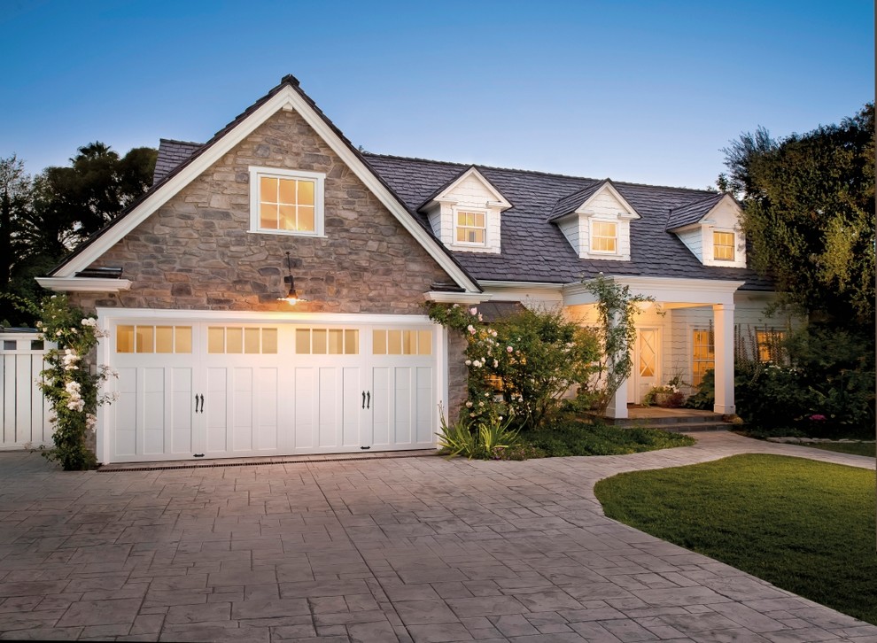 Design ideas for a mid-sized arts and crafts attached two-car garage in Other.