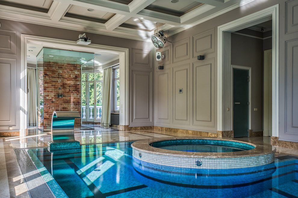 Traditional indoor rectangular lap pool in Moscow with a hot tub and tile.
