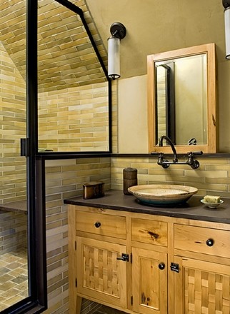 Photo of an expansive country master bathroom in Burlington with a vessel sink, furniture-like cabinets, light wood cabinets, limestone benchtops, an alcove shower, brown tile, ceramic tile, brown walls, ceramic floors, brown floor and a hinged shower door.