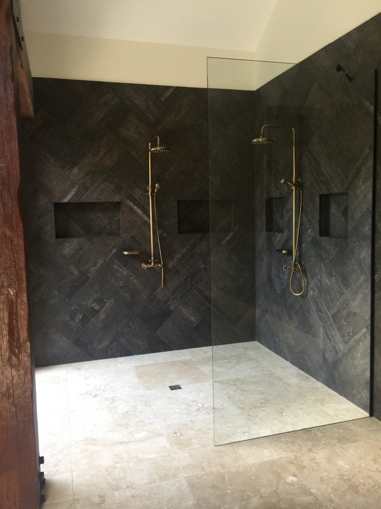 Design ideas for a tropical master bathroom in Sunshine Coast with an open shower, gray tile, stone tile and travertine floors.