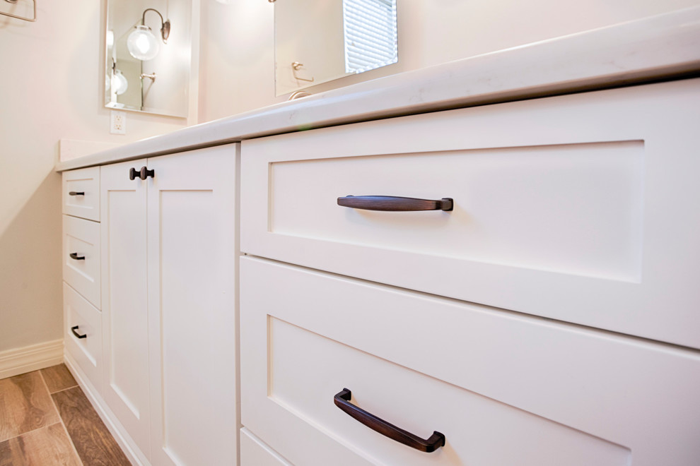 Example of a huge transitional master brown tile and porcelain tile porcelain tile freestanding bathtub design in Phoenix with shaker cabinets, white cabinets, a two-piece toilet, gray walls, an undermount sink and quartzite countertops