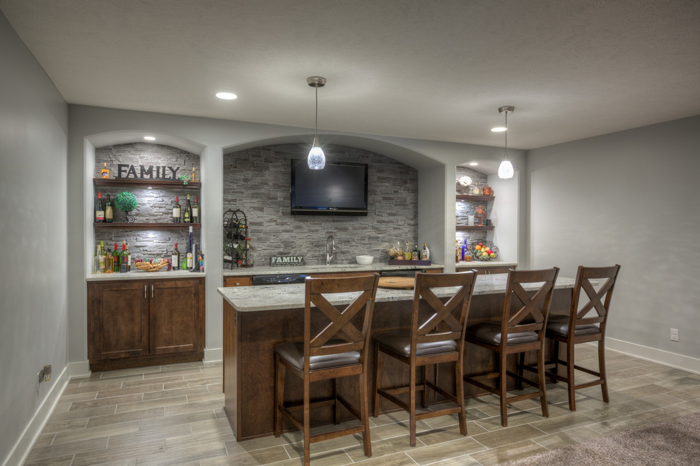 This is an example of a transitional home bar in Omaha.