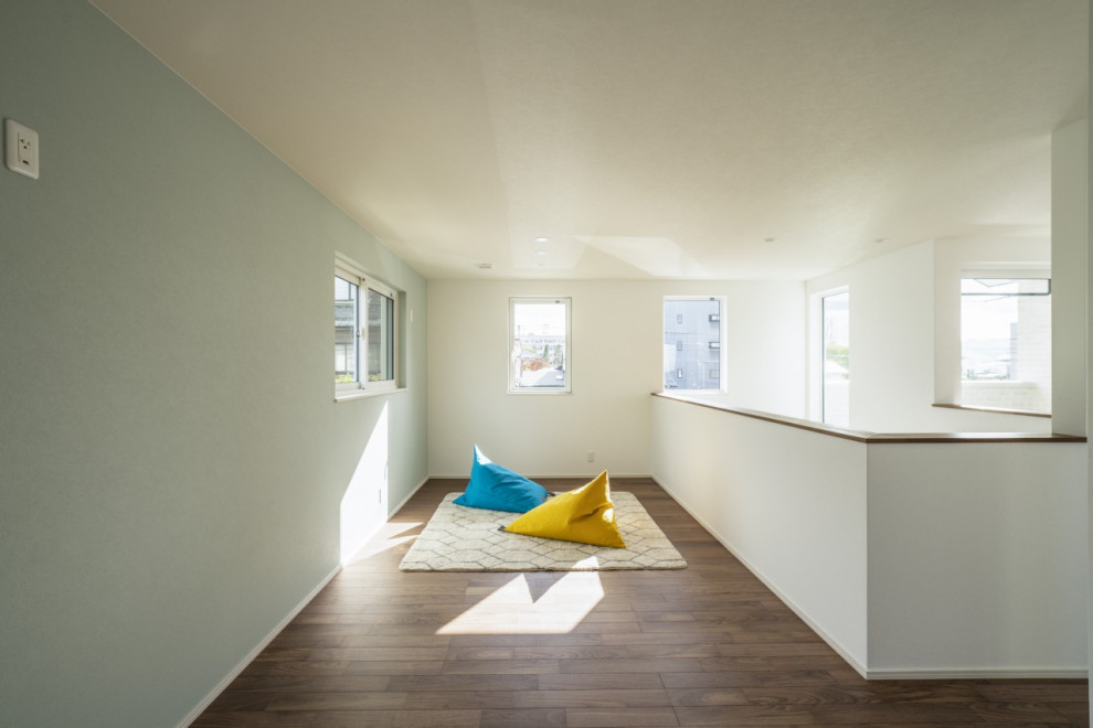 Mid-sized minimalist gender-neutral dark wood floor, brown floor, wallpaper ceiling and wallpaper kids' room photo in Other with green walls