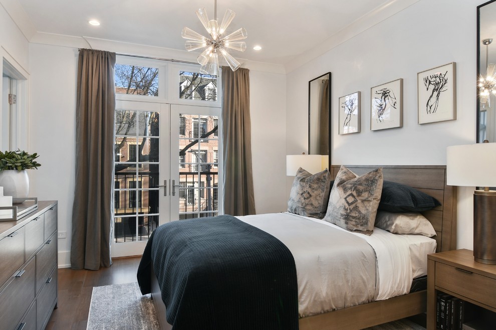 Transitional bedroom in Chicago with grey walls, dark hardwood floors and brown floor.