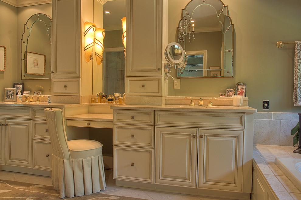 Large traditional master bathroom in Other with beaded inset cabinets, beige cabinets, a drop-in tub, green walls, an undermount sink and solid surface benchtops.