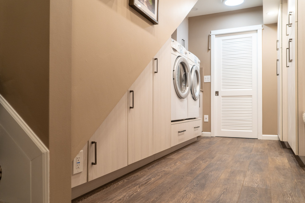 Inspiration for a contemporary laundry room remodel with flat-panel cabinets