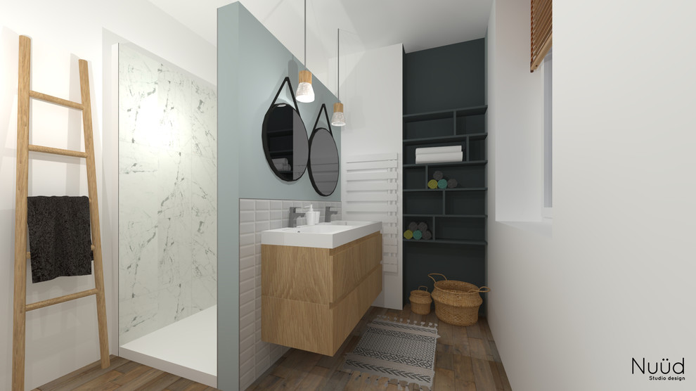 Mid-sized contemporary master bathroom in Lille with light wood cabinets, an open shower, white tile, marble, blue walls, light hardwood floors, a wall-mount sink, an open shower and white benchtops.