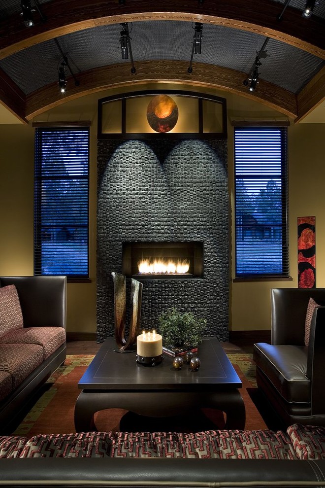 This is an example of a contemporary living room in Phoenix with yellow walls and a ribbon fireplace.