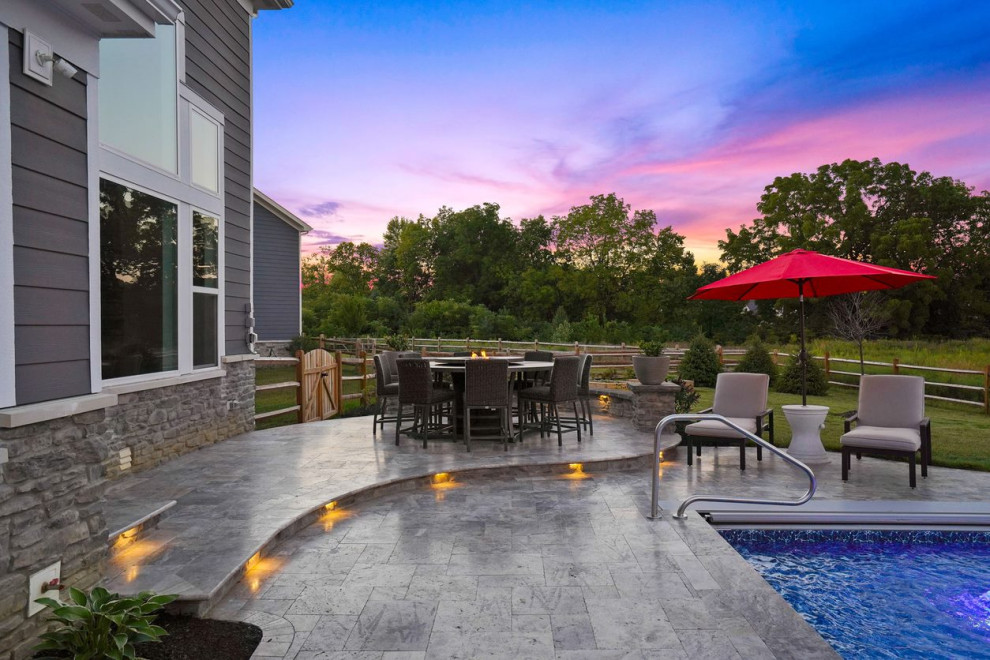 Pavilion with outdoor kitchen, gas fireplace and swim up bar. Patio