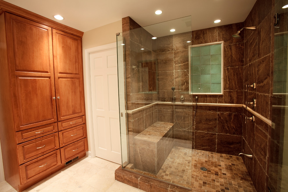 Example of a mid-sized classic master brown tile and ceramic tile porcelain tile alcove shower design in Chicago with raised-panel cabinets, medium tone wood cabinets, beige walls and an undermount sink