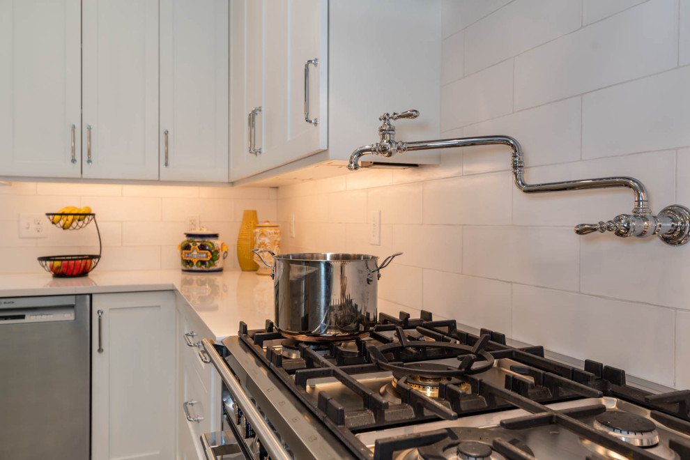 Example of a transitional kitchen design in Denver