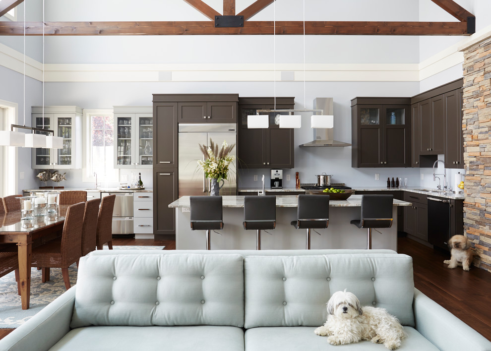 Open concept kitchen - transitional l-shaped dark wood floor open concept kitchen idea in Chicago with an undermount sink, shaker cabinets, brown cabinets, stainless steel appliances and an island