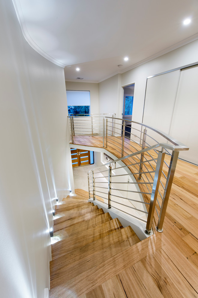 Design ideas for a mid-sized contemporary wood floating staircase in Perth with wood risers.