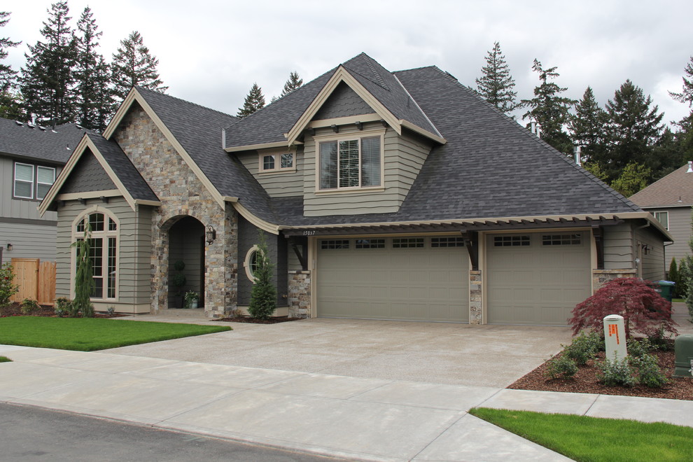 Transitional two-storey exterior in Portland with stone veneer.