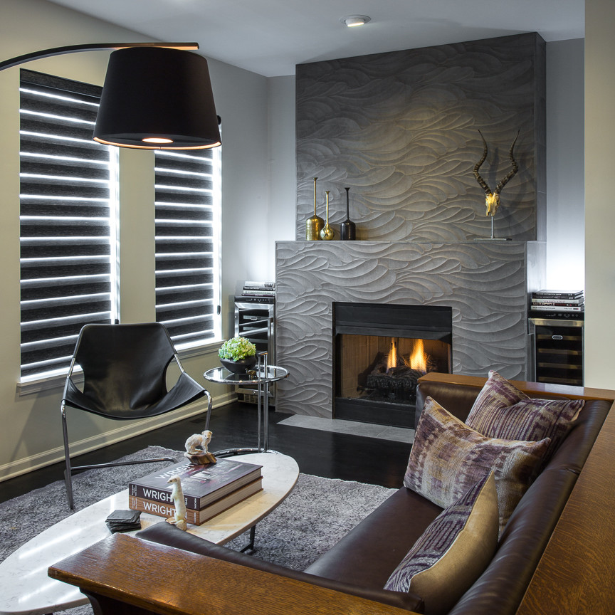 Photo of a small modern open concept living room in Chicago with beige walls, dark hardwood floors, a standard fireplace, a tile fireplace surround and brown floor.