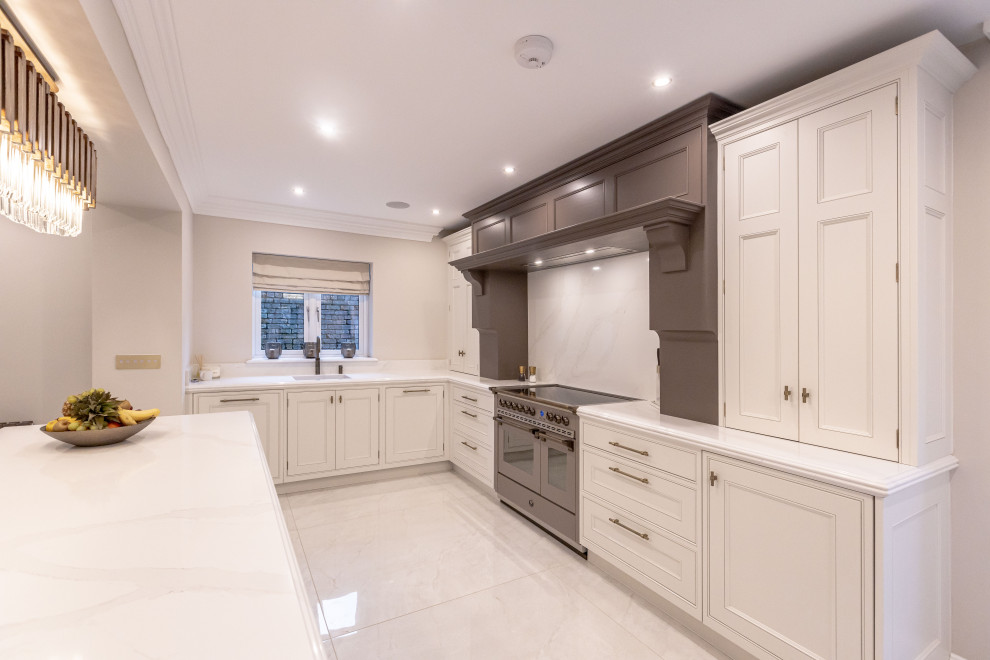 This is an example of a mid-sized contemporary kitchen in Other with granite benchtops, white splashback, granite splashback, white appliances, with island and white benchtop.