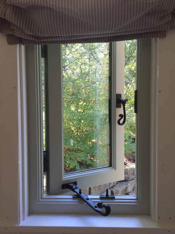 Example of a small transitional detached guesthouse design in Detroit