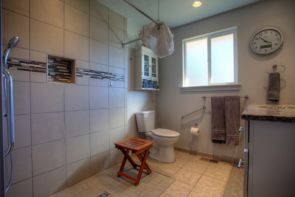 Inspiration for a mid-sized contemporary beige tile and porcelain tile porcelain tile walk-in shower remodel in Seattle with shaker cabinets, white cabinets, a two-piece toilet, white walls, an undermount sink and granite countertops