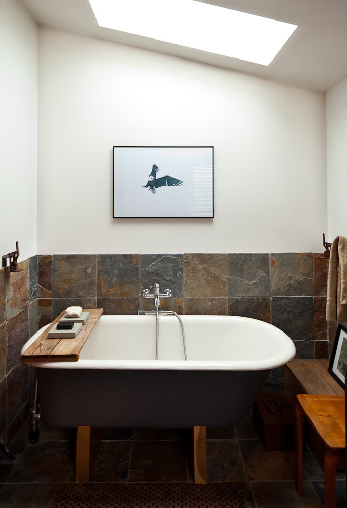 This is an example of an eclectic bathroom in Other with slate.