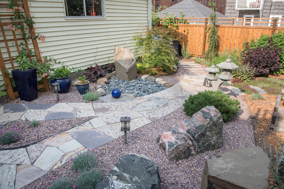 Mid-sized asian backyard full sun formal garden in Milwaukee with a garden path and natural stone pavers for summer.
