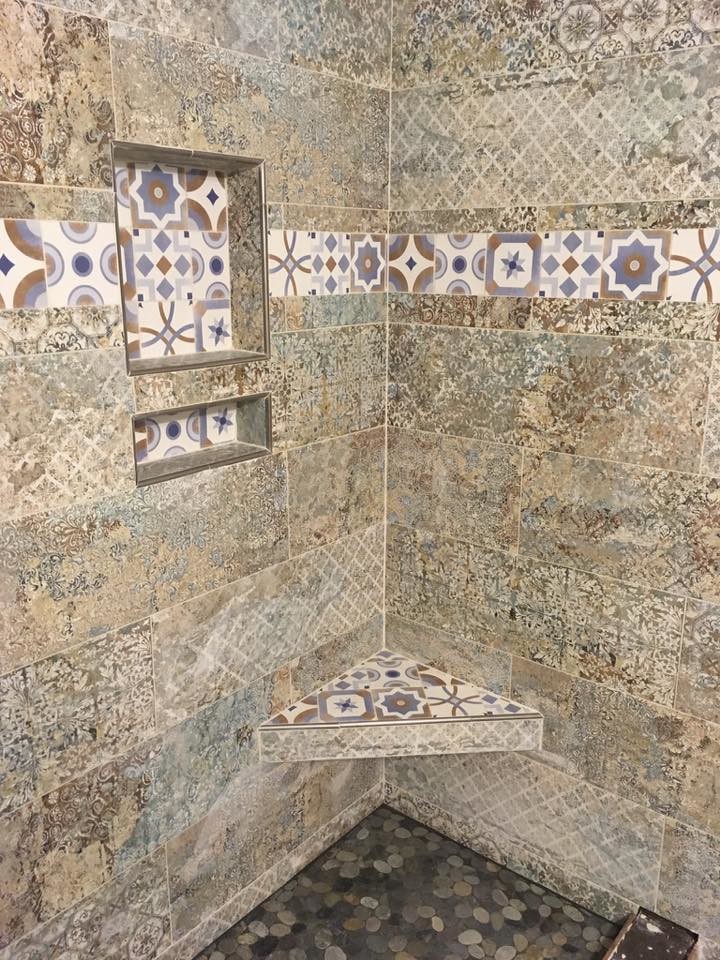 Small mediterranean 3/4 bathroom in Miami with a corner shower, beige tile, ceramic tile, beige walls, porcelain floors, brown floor and an open shower.