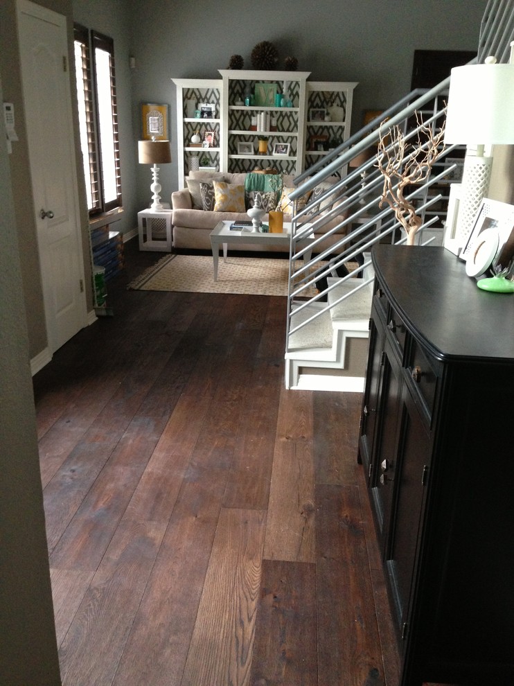Inspiration for a mid-sized modern dark wood floor vestibule remodel in Austin with gray walls and a white front door