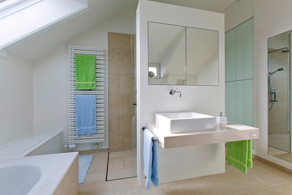 Large contemporary master bathroom in Hamburg with flat-panel cabinets, white cabinets, a drop-in tub, an open shower, a two-piece toilet, green tile, glass sheet wall, white walls, marble floors, a vessel sink and granite benchtops.