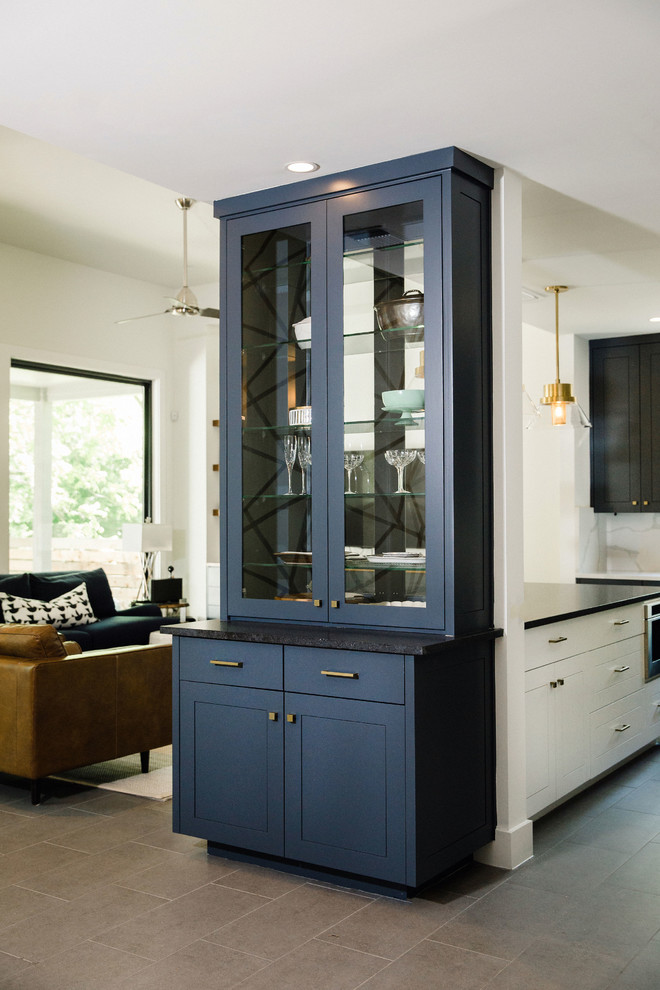 Home design - mid-sized transitional l-shaped cement tile floor and gray floor home design idea in Austin with an undermount sink, flat-panel cabinets, blue cabinets, quartz countertops, white backsplash, stainless steel appliances, an island and white countertops