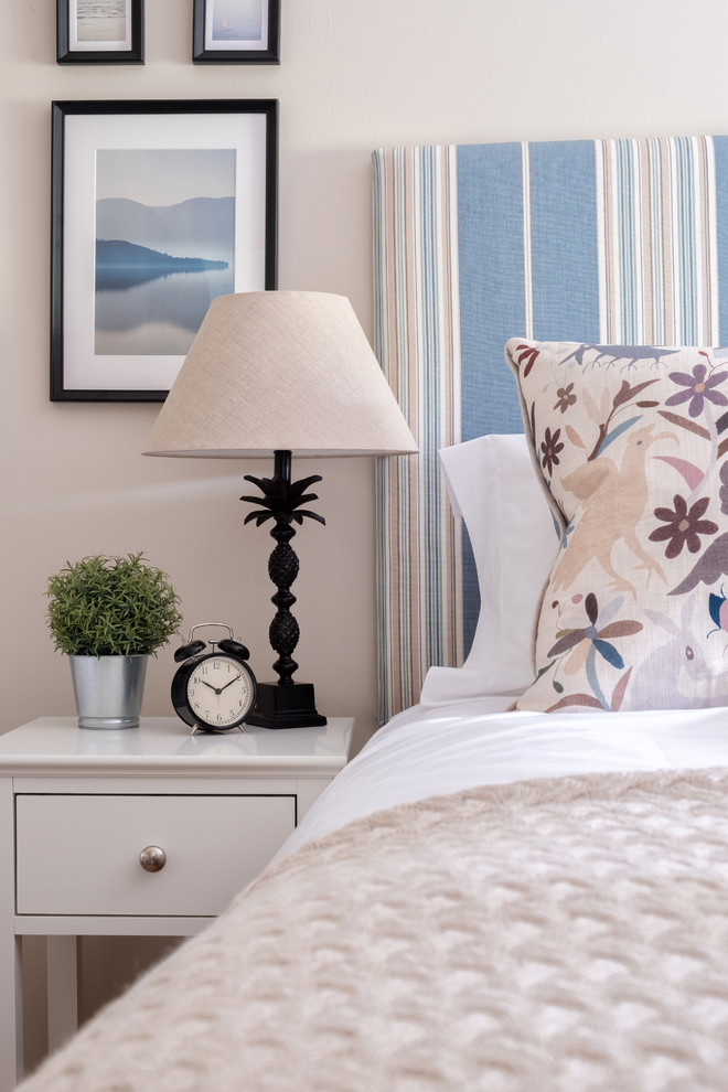 Design ideas for a large country guest bedroom in Edinburgh with white walls and carpet.