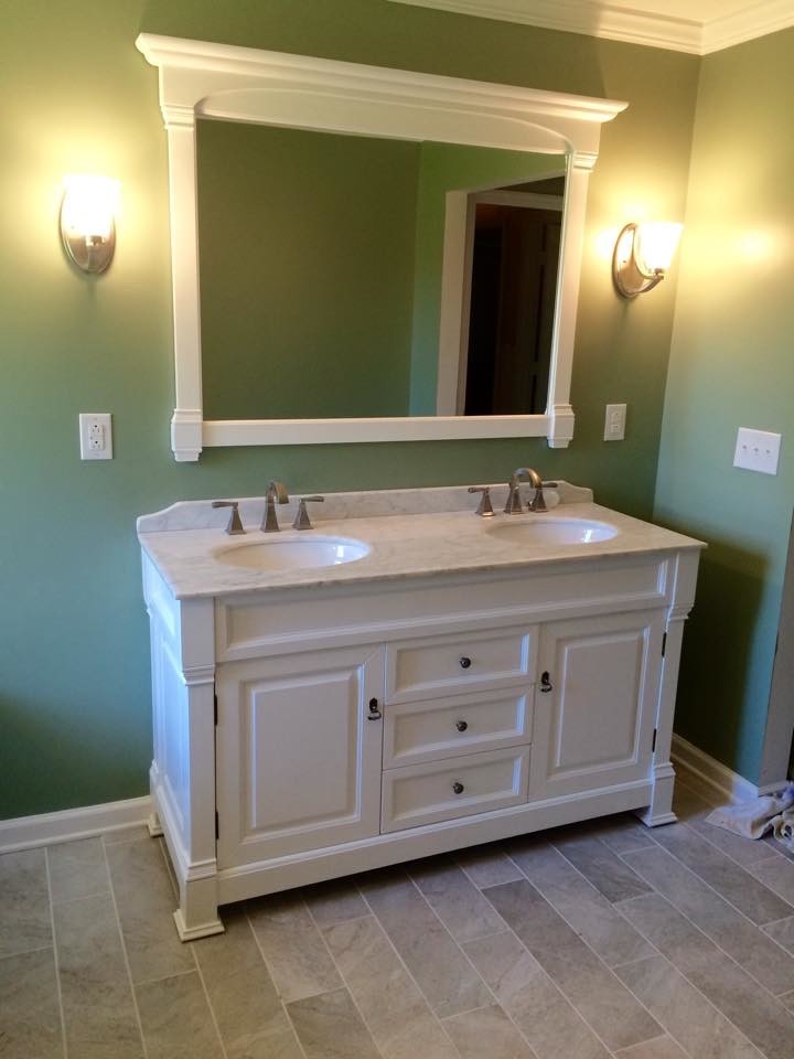 Inspiration for a mid-sized traditional master bathroom in Nashville with a drop-in sink, raised-panel cabinets, white cabinets, laminate benchtops, a drop-in tub, a corner shower, a one-piece toilet, multi-coloured tile, green walls and ceramic floors.