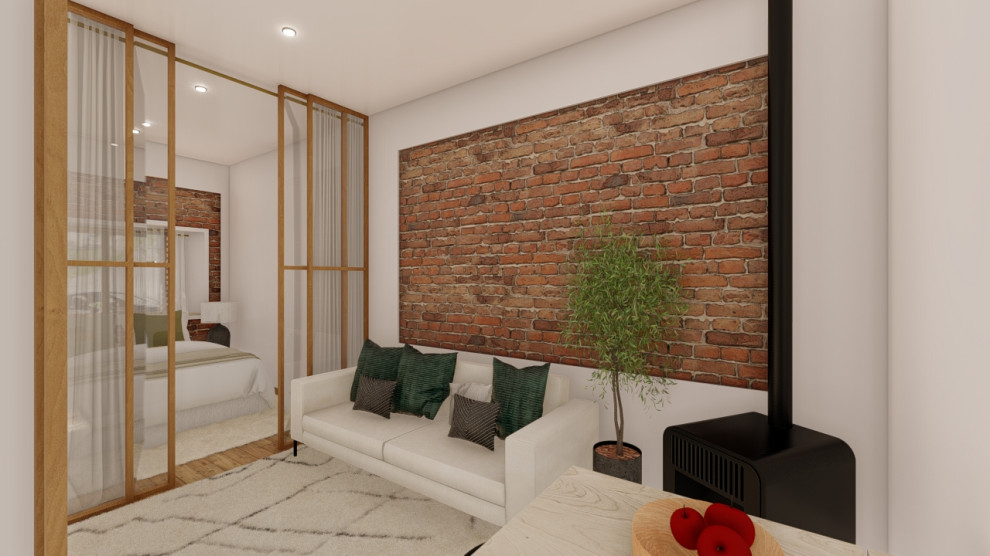 Cette image montre une petite chambre mansardée ou avec mezzanine chalet avec un sol en bois brun, un poêle à bois, un sol marron et un mur en parement de brique.