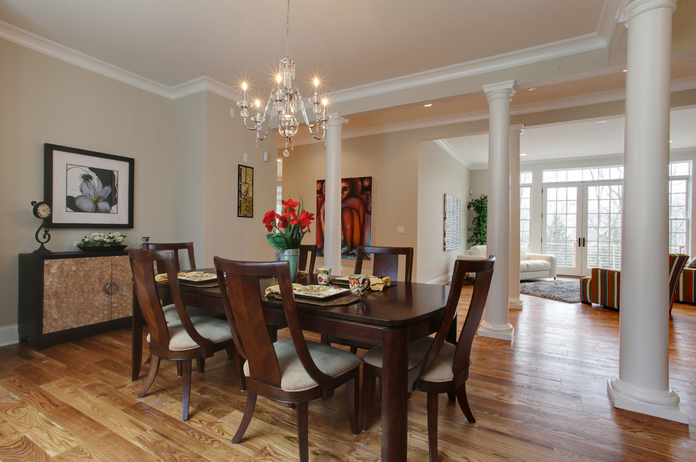 Photo of a contemporary open plan dining in New York with medium hardwood floors and beige walls.