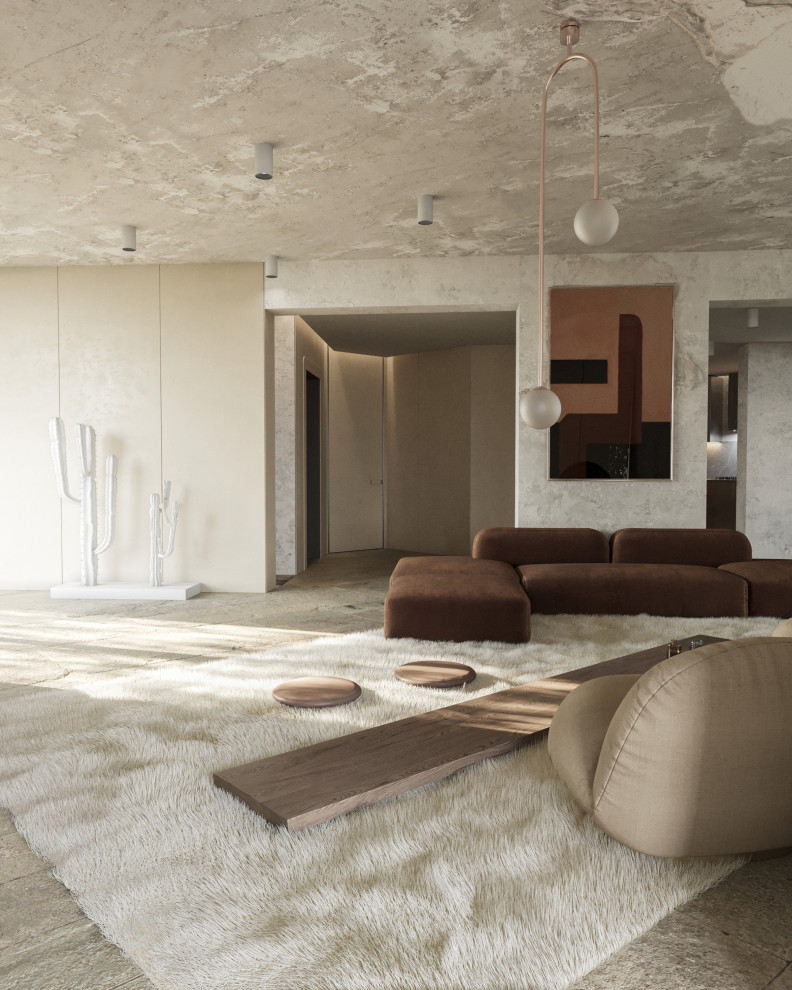 Ispirazione per un piccolo soggiorno minimalista stile loft con pareti beige, pavimento in pietra calcarea e pavimento beige