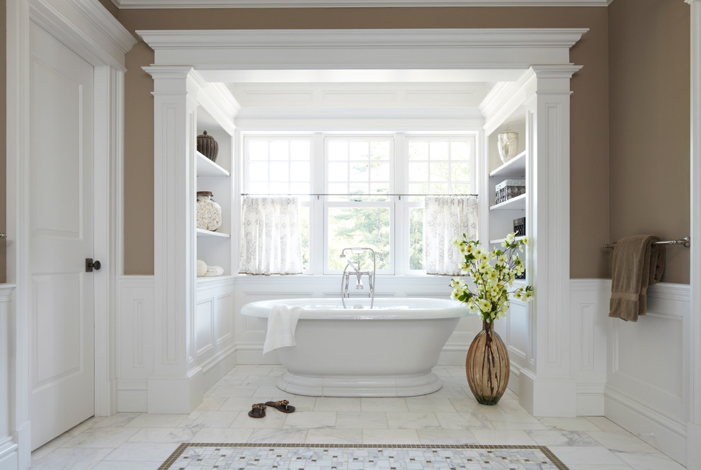 Inspiration for a traditional bathroom in New York with a freestanding tub and brown walls.