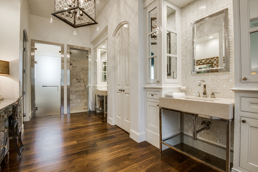 Design ideas for a mediterranean bathroom in Dallas with an undermount sink, beaded inset cabinets, white cabinets, white walls, dark hardwood floors and beige benchtops.