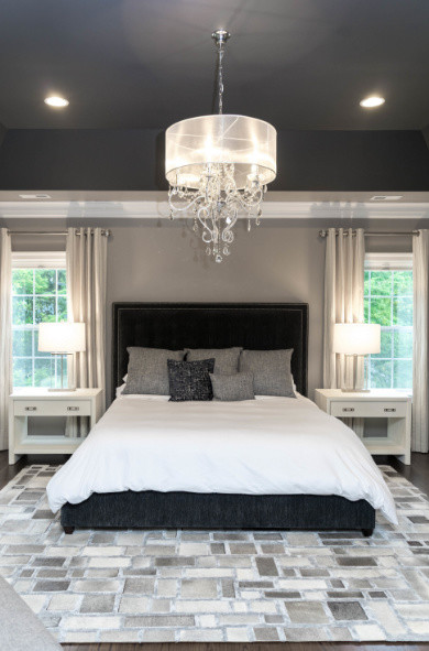 Example of a large transitional master dark wood floor and brown floor bedroom design in DC Metro with beige walls and no fireplace