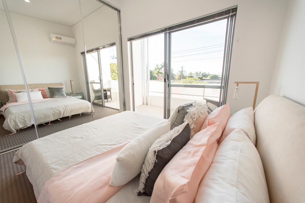 Design ideas for a contemporary master bedroom in Perth with white walls and carpet.