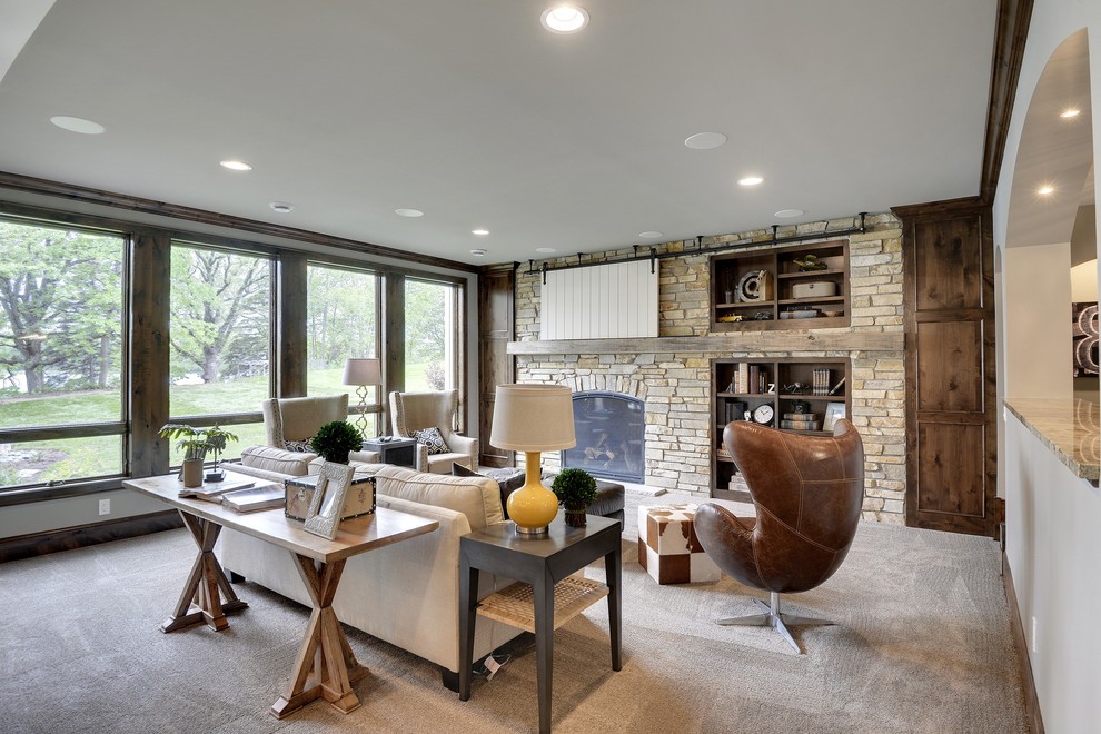 Large transitional formal open concept living room in Minneapolis with beige walls, carpet, a standard fireplace, a stone fireplace surround and a wall-mounted tv.