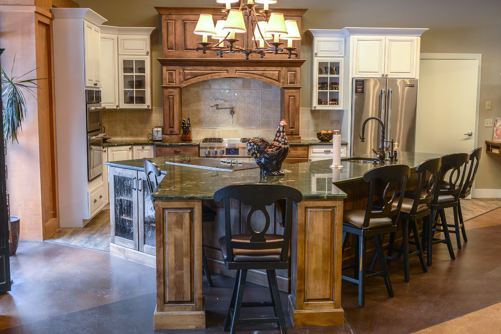 Eat-in kitchen - mid-sized rustic l-shaped concrete floor eat-in kitchen idea with an undermount sink, recessed-panel cabinets, blue cabinets, solid surface countertops, gray backsplash, porcelain backsplash, stainless steel appliances and an island