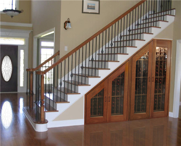Mid-sized elegant wooden straight wood railing staircase photo in Orange County with painted risers