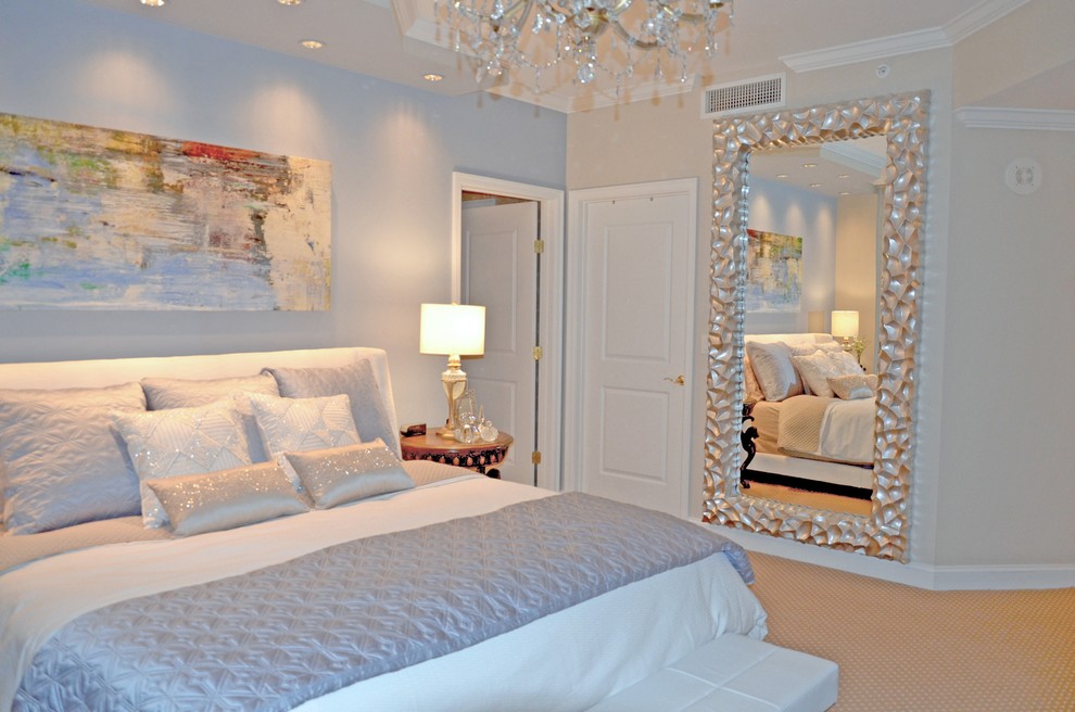 Example of a large beach style master carpeted bedroom design in Montreal with blue walls